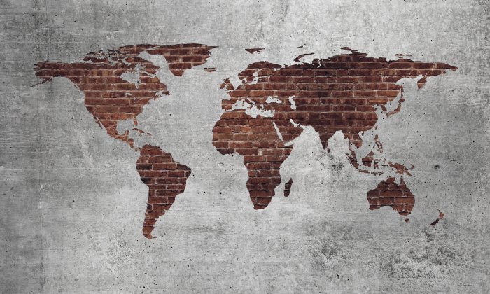 Papier peint  Carte du monde en briques rouges sur fond texturé