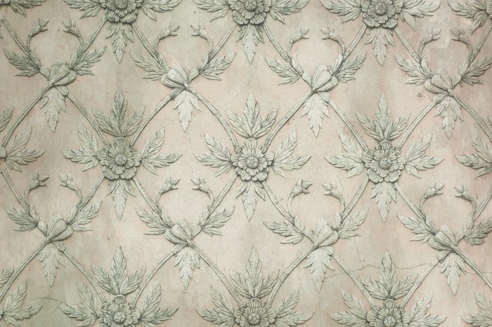 Papier peint  Stuc floral sur fond de béton