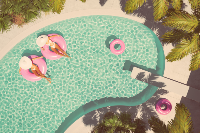 Tableau  Vue de dessus de la piscine et des femmes en cerceaux roses