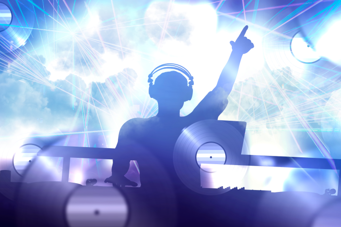 Poster  DJ derrière la console sous les projecteurs