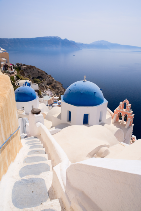 Poster  Terrasse ensoleillée avec vue sur Santorin