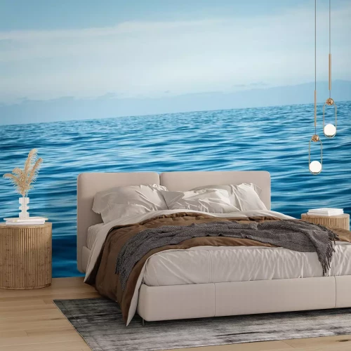 Papier peint  Eaux calmes de l'océan sur fond de ciel