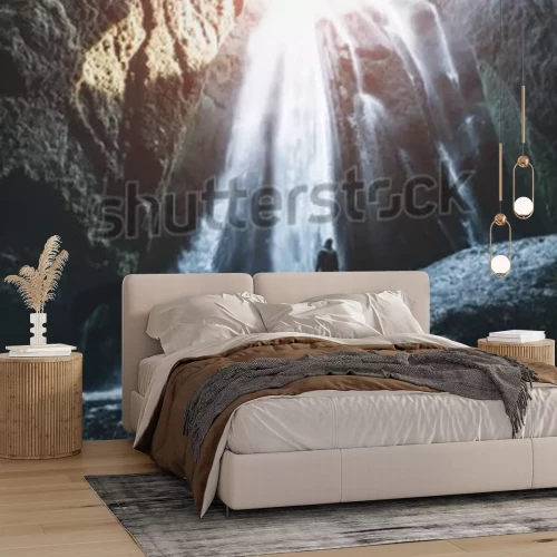 Papier peint  Chute d'eau dans une grotte en Islande