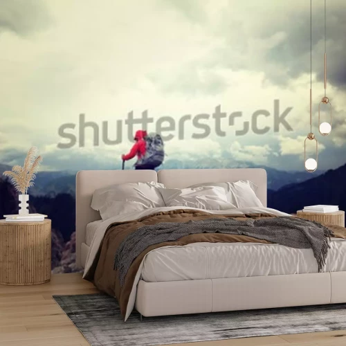 Papier peint  Une personne au sommet d'une montagne