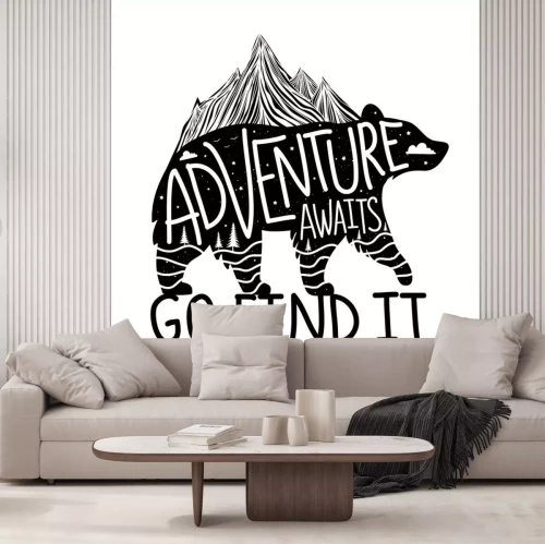Sticker  Vector illustration with bear silhouette and lettering text - Adventure awaits, Go find it.