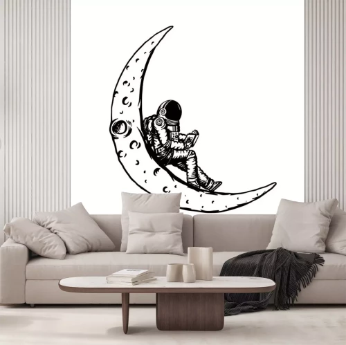 Sticker  Astronaute lisant un livre sur la lune