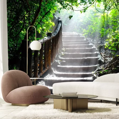 Sticker  A ray of sunlight breaks through the leaves of the trees in the thicket of the forest on the stairs.