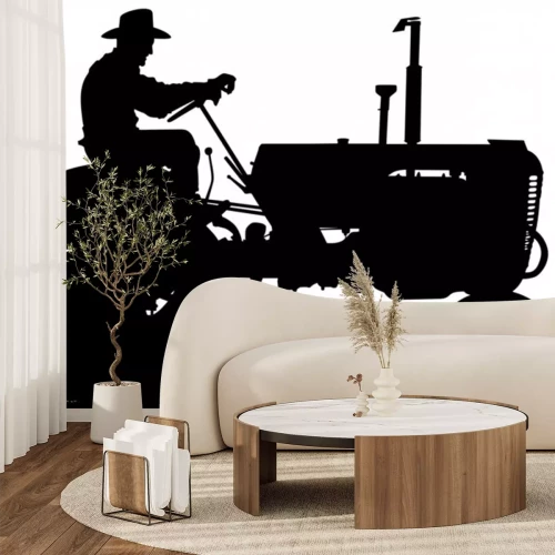 Sticker  A vector silhouette of an old farmer driving an old tractor.