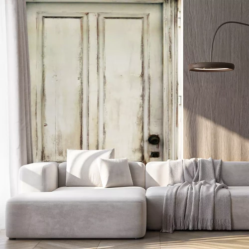 Sticker  Old worn white door damaged and with ancient texturee from an abandoned building