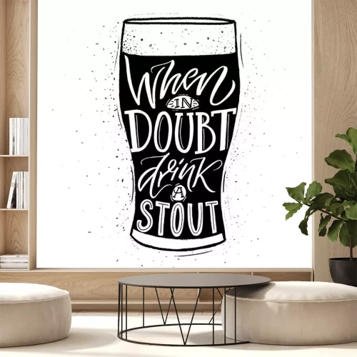 Sticker  When in doubt, drink a stout. Funny inspirational quote about beer with hand lettering for pubs, bars and t-shirt design. Black and whiite typographic design.