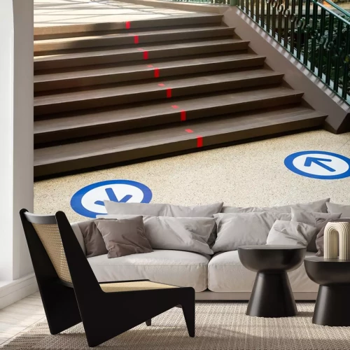 Sticker  Epidemic protection measures in shops, shopping malls or centres floor blue circle stickers with arrow . Social Distance Shopping. Life after virus. Secure marking of lines on floor for directions,