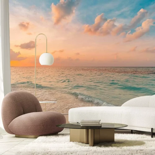 Papier peint  Les vagues de la mer atteignant la plage au lever du soleil