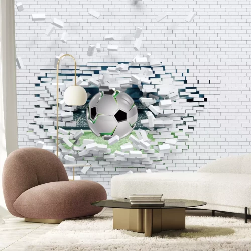 Papier peint  Ballon de football traversant un mur de briques