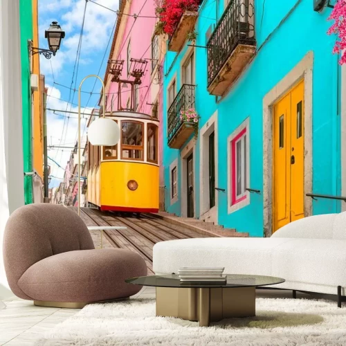 Papier peint  Lisbon, Portugal - Yellow tram on a street with colorful houses and flowers on the balconies - Bica Elevator going down the hill of Chiado.