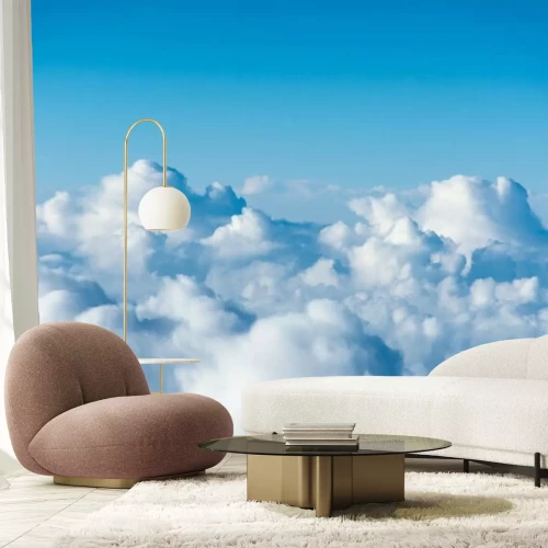 Papier peint  Flight over the clouds. view of the clouds from the airplane window