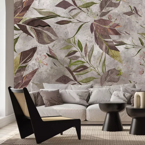 Papier peint  Feuilles brunes et vertes sur fond de béton
