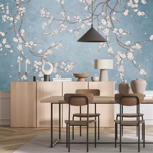 Papier peint  Branches d'arbres en fleurs sur fond bleu