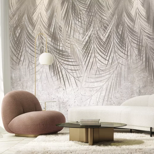 Papier peint  Feuilles tropicales suspendues au-dessus d'un fond gris texturé