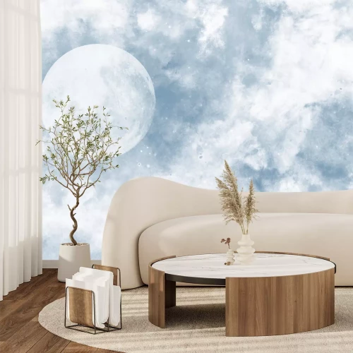 Papier peint  La lune parmi les nuages sur fond bleu