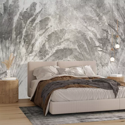 Papier peint  Grandes feuilles tropicales grises sur béton