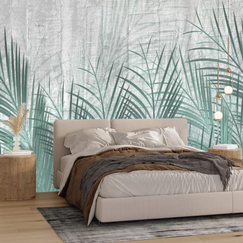 Papier peint  Feuilles de palmier vertes sur fond de béton gris