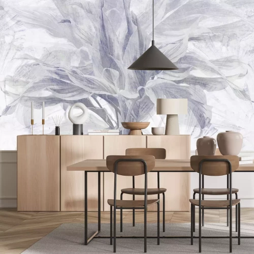 Papier peint  Feuilles de plantes tropicales sur un fond de béton texturé