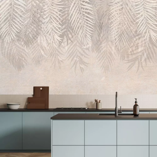 Papier peint  Une composition végétale avec des feuilles de palmier sur fond beige