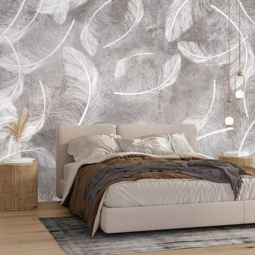 Papier peint  Plumes blanches sur fond béton gris style loft