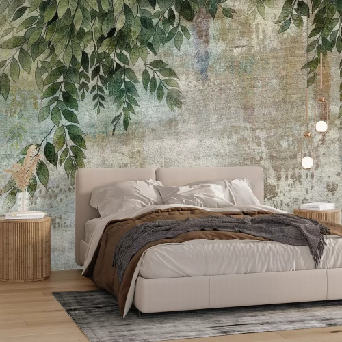 Papier peint  Feuilles vertes suspendues sur béton