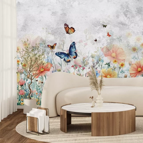 Papier peint  Papillons au-dessus d’une prairie fleurie colorée sur fond texturé dans des tons de gris