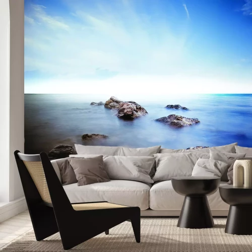 Papier peint  Rochers sur une mer brumeuse