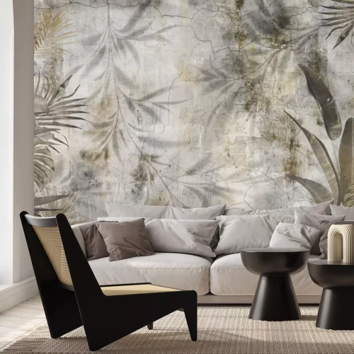 Papier peint  Feuilles exotiques sur béton nature