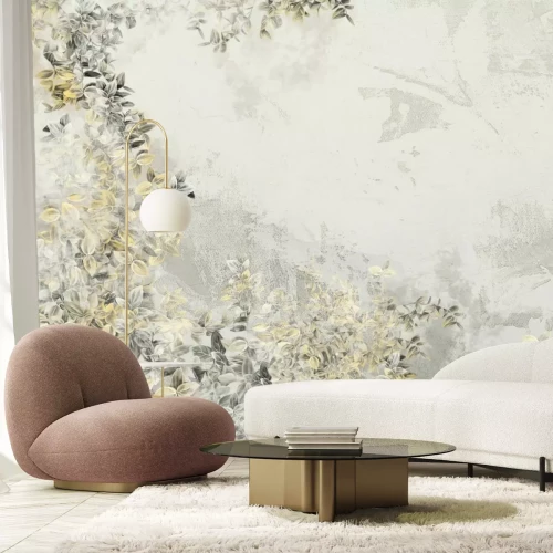 Papier peint  Feuilles grises et jaunes sur du béton