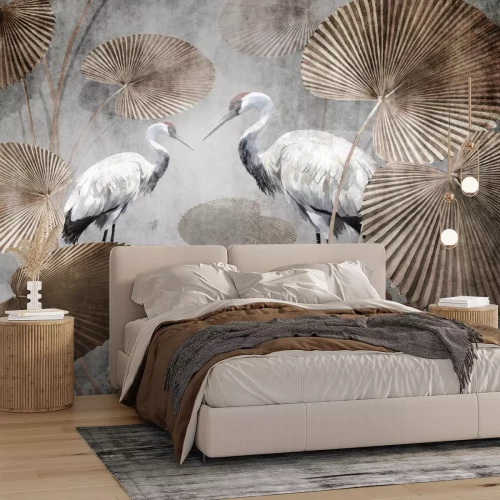 Papier peint  Grues blanches parmi de grandes feuilles tropicales