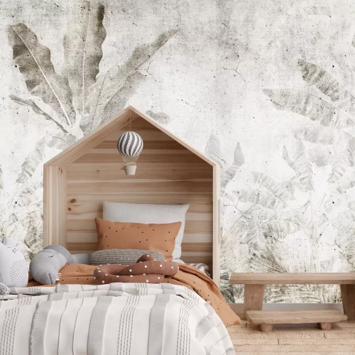 Papier peint  Feuilles de bananier sur un mur en béton dans un style urban jungle