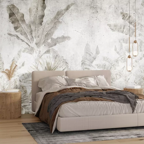 Papier peint  Feuilles de bananier sur un mur en béton dans un style urban jungle