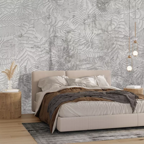 Papier peint  Feuilles tropicales sur fond en béton texturé