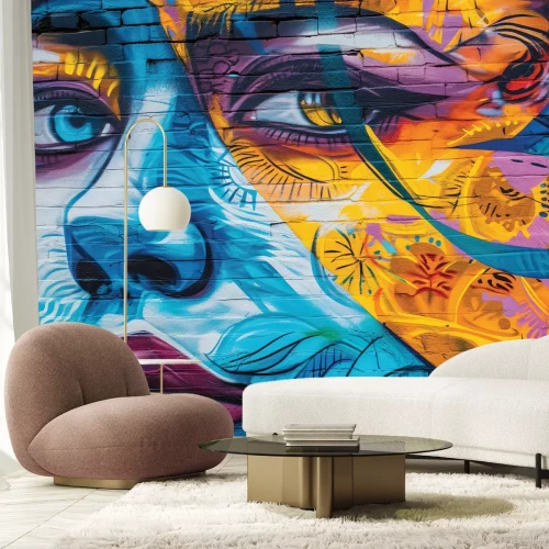 Papier peint  Visage de femme sur un mur de briques colorées