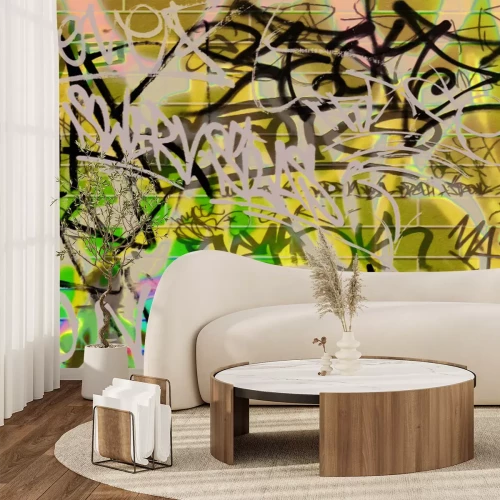 Papier peint  Inscriptions artistiques sur un mur de briques violettes