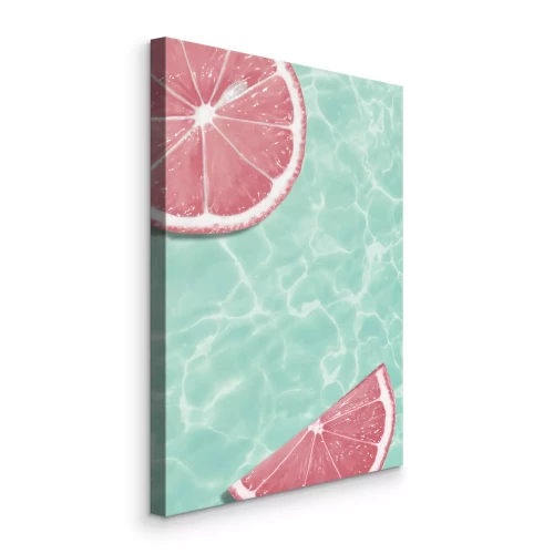 Tableau  Des tranches de pamplemousse sur fond d'eau turquoise