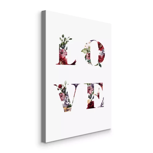 Tableau  L'inscription « Amour » est composée de fleurs sur fond blanc.