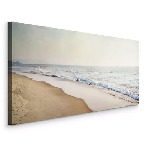 Tableau  Une large plage de sable au bord de la mer