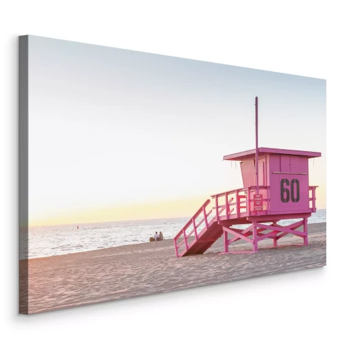 Tableau  Un poste de surveillance de sauveteurs aux couleurs pastel surplombant l'océan au lever du soleil