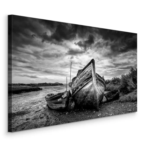 Tableau  De vieux bateaux en bois sous un ciel orageux