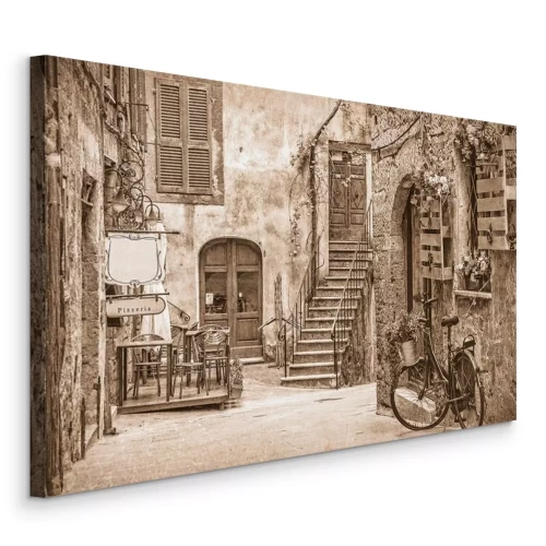 Tableau  Une charmante rue pavée dans une ville tranquille