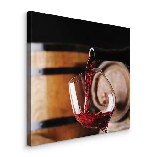 Tableau  Du vin dans un verre avec un fond rustique de tonneaux