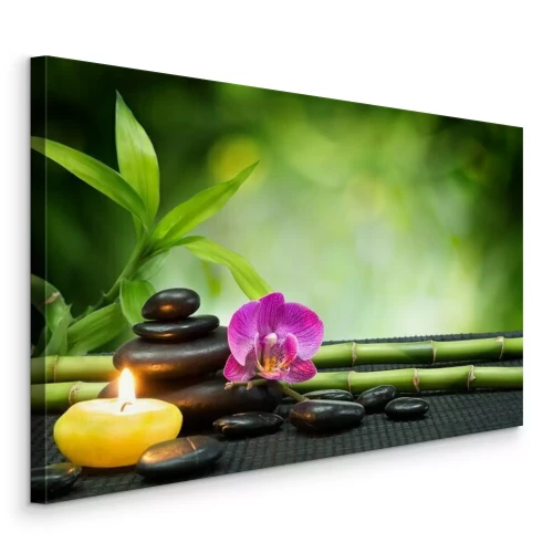 Tableau  Pierres thermales et orchidée sur un tapis en bambou