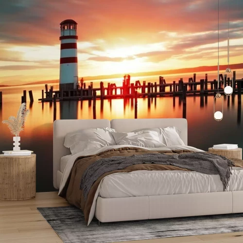 Papier peint  Un phare avec le soleil levant en arrière-plan