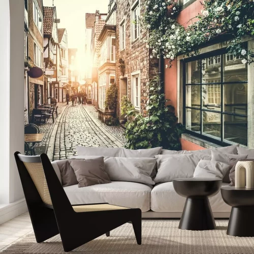 Papier peint  Rue historique en Europe au coucher du soleil avec effet rétro vintage