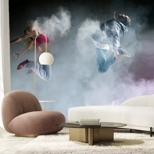 Papier peint  Danseurs sautant entourés de fumée et de lumière